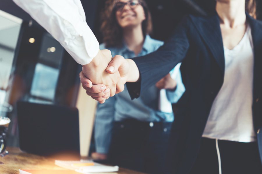 IA&B Partnership - Strong Handshake with Colleagues